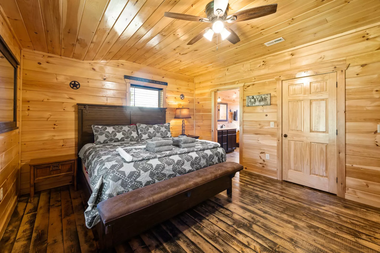 Nothin’ But a Good Time – a spacious 4-bedroom Smoky Mountain cabin rental in Sevierville featuring king bedrooms, twin bunks, hot tub, theater room, fire pit, and cozy mountain views.