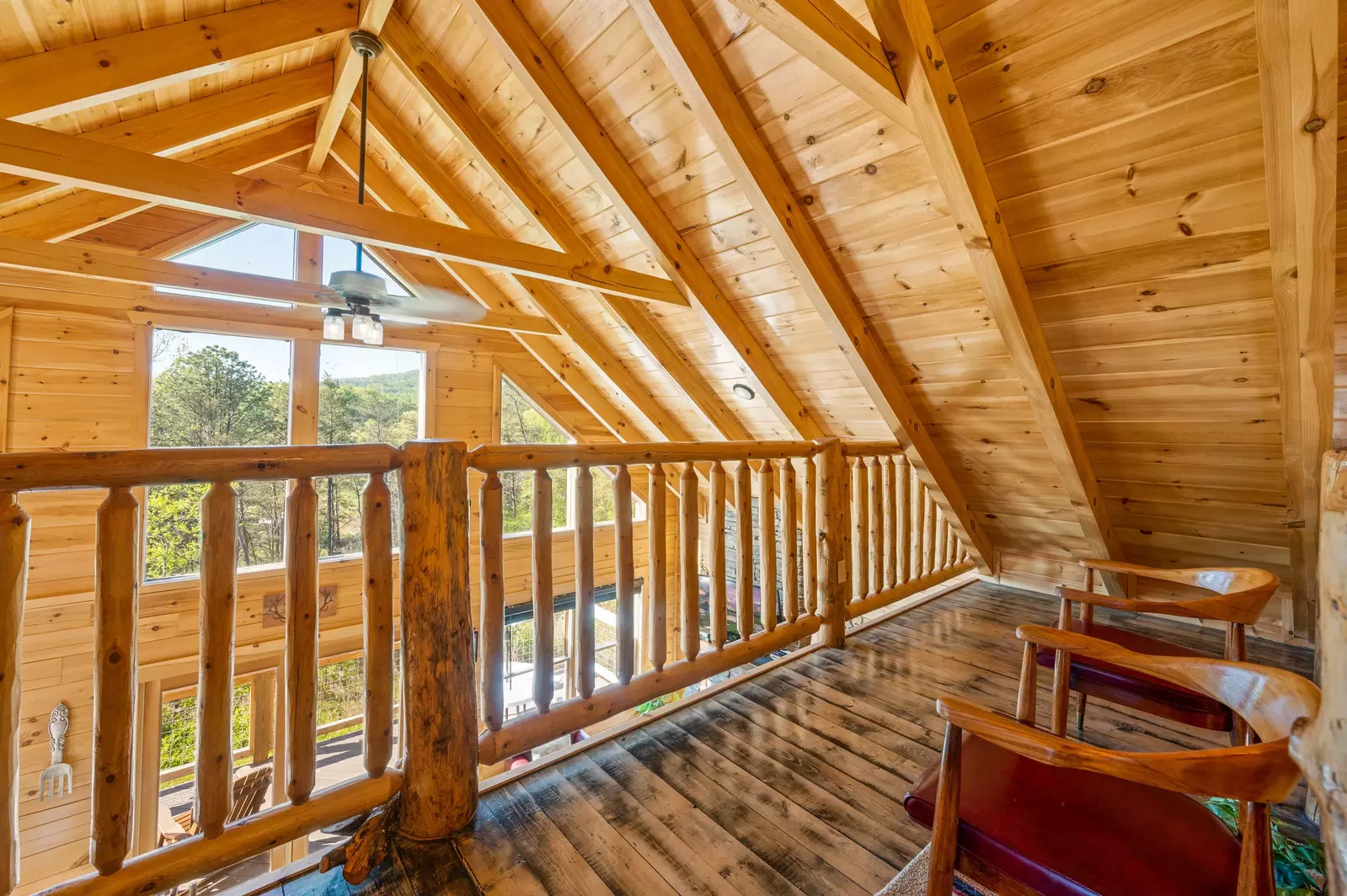 Nothin’ But a Good Time – a spacious 4-bedroom Smoky Mountain cabin rental in Sevierville featuring king bedrooms, twin bunks, hot tub, theater room, fire pit, and cozy mountain views.
