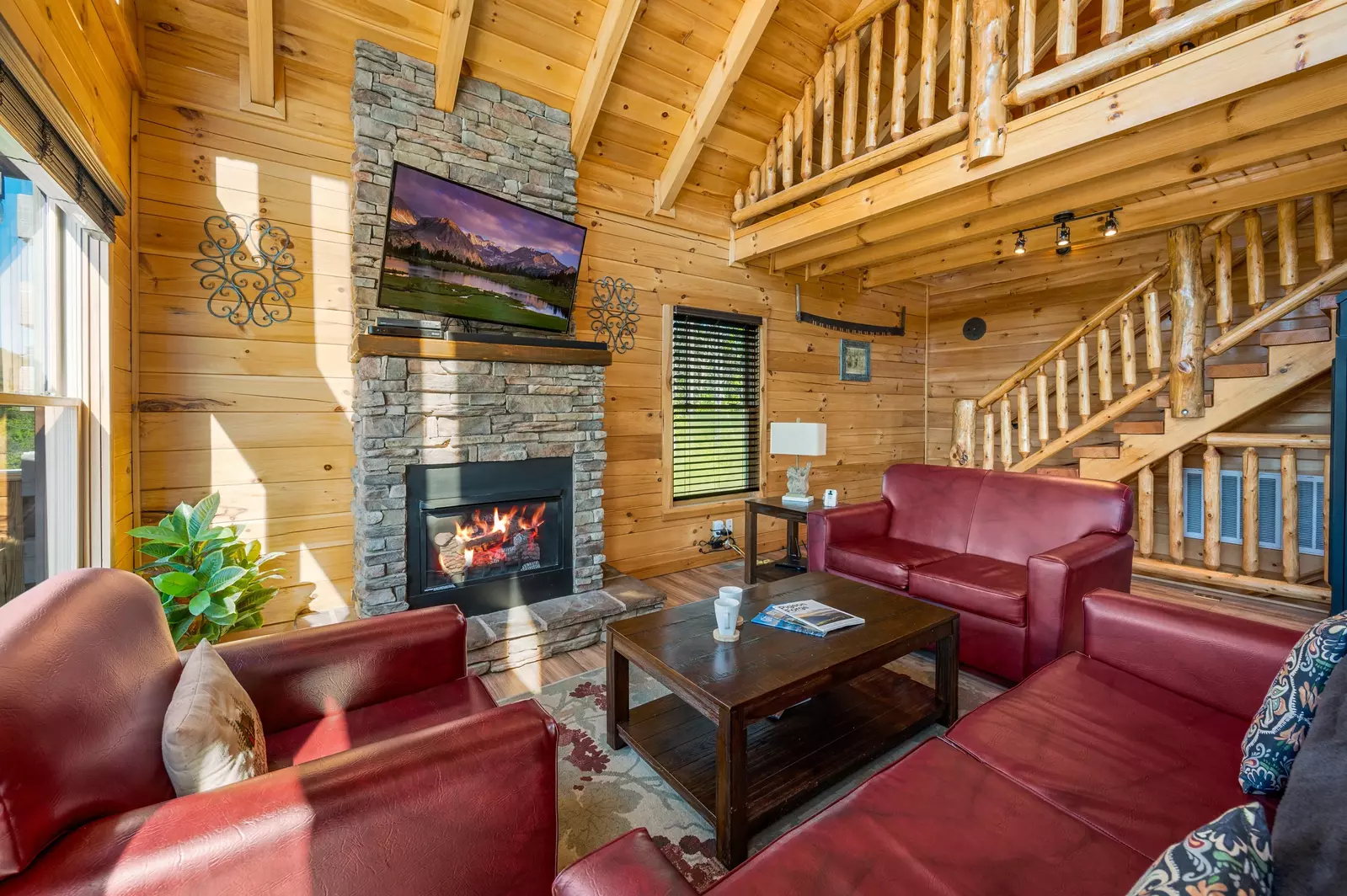 Nothin’ But a Good Time – a spacious 4-bedroom Smoky Mountain cabin rental in Sevierville featuring king bedrooms, twin bunks, hot tub, theater room, fire pit, and cozy mountain views.