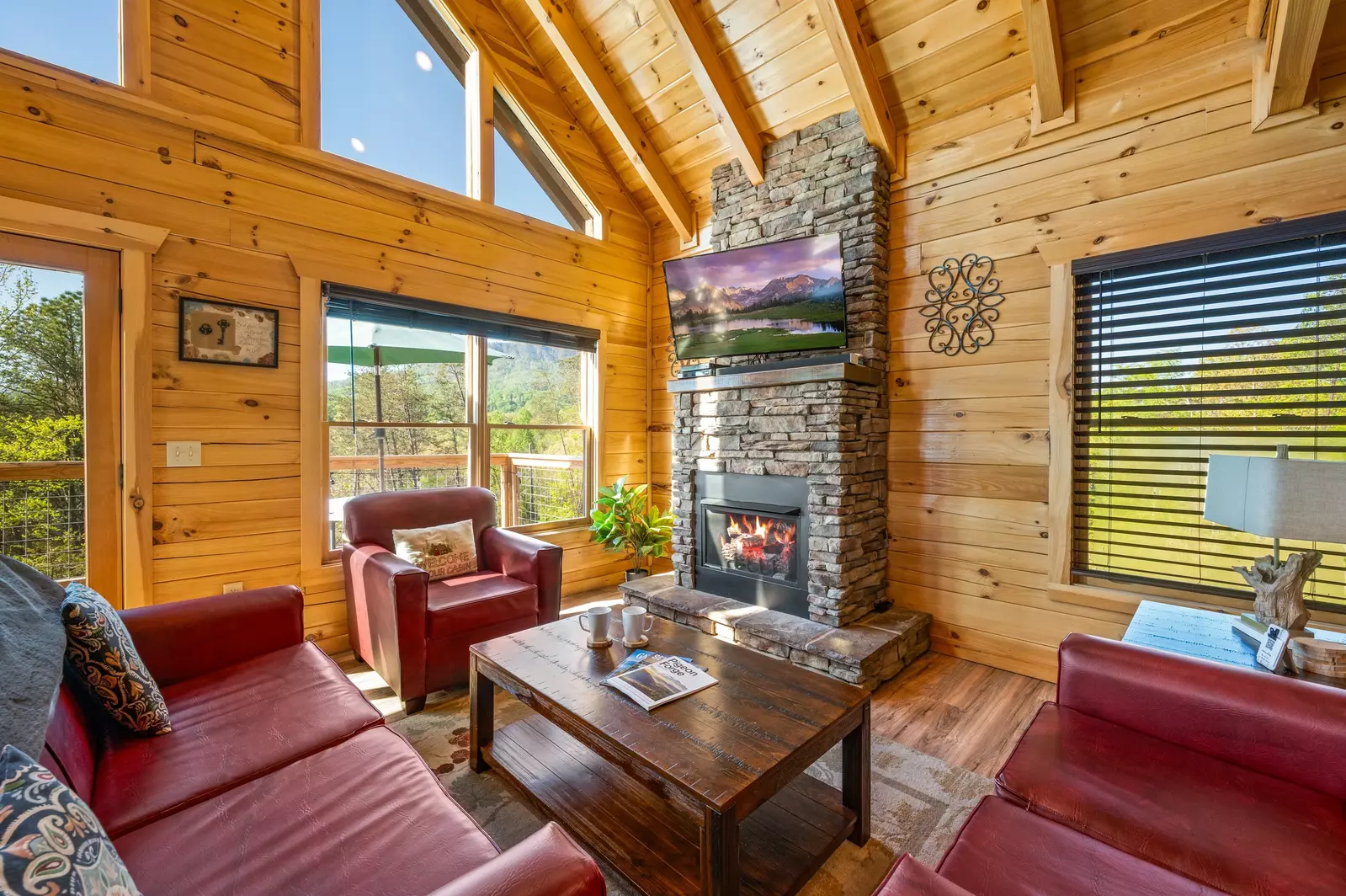 Nothin’ But a Good Time – a spacious 4-bedroom Smoky Mountain cabin rental in Sevierville featuring king bedrooms, twin bunks, hot tub, theater room, fire pit, and cozy mountain views.