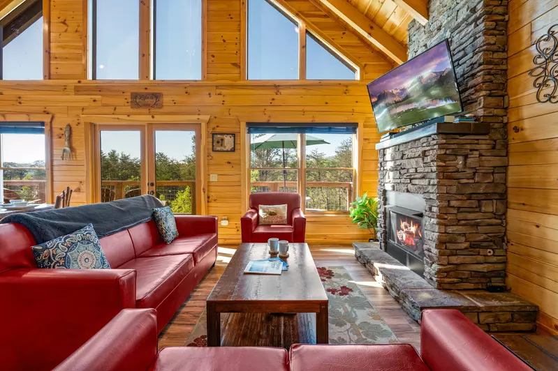 Nothin’ But a Good Time – a spacious 4-bedroom Smoky Mountain cabin rental in Sevierville featuring king bedrooms, twin bunks, hot tub, theater room, fire pit, and cozy mountain views.
