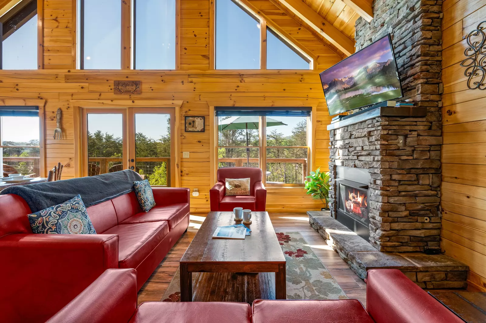 Nothin’ But a Good Time – a spacious 4-bedroom Smoky Mountain cabin rental in Sevierville featuring king bedrooms, twin bunks, hot tub, theater room, fire pit, and cozy mountain views.