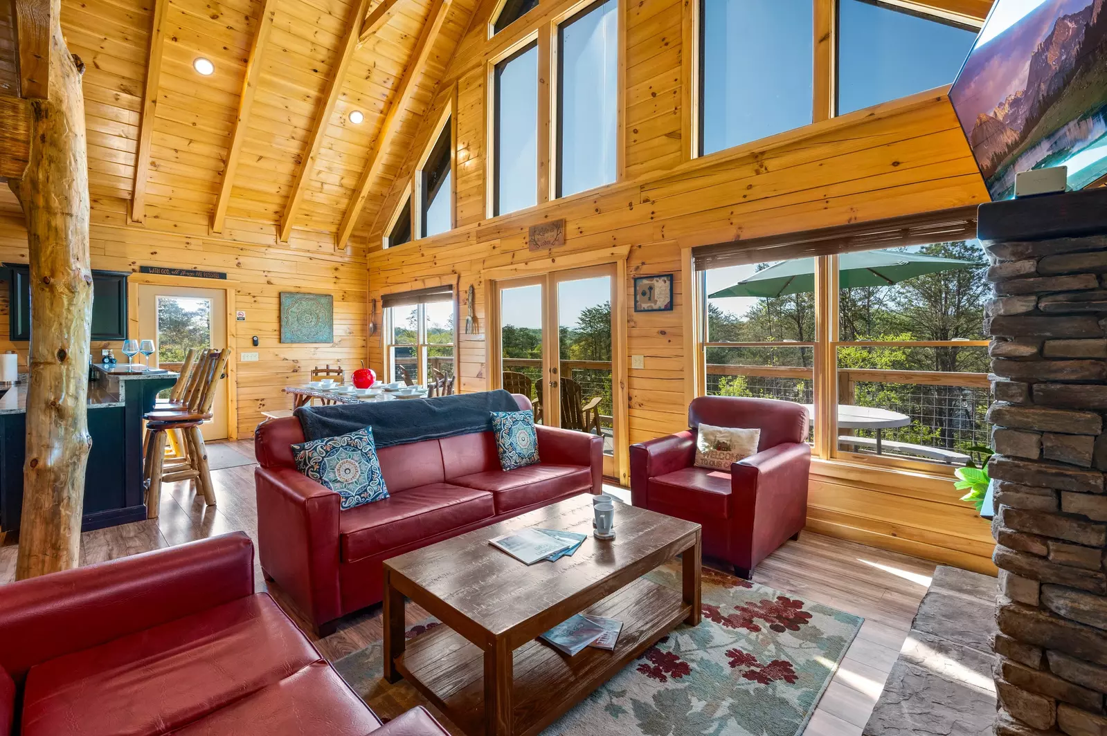 Nothin’ But a Good Time – a spacious 4-bedroom Smoky Mountain cabin rental in Sevierville featuring king bedrooms, twin bunks, hot tub, theater room, fire pit, and cozy mountain views.