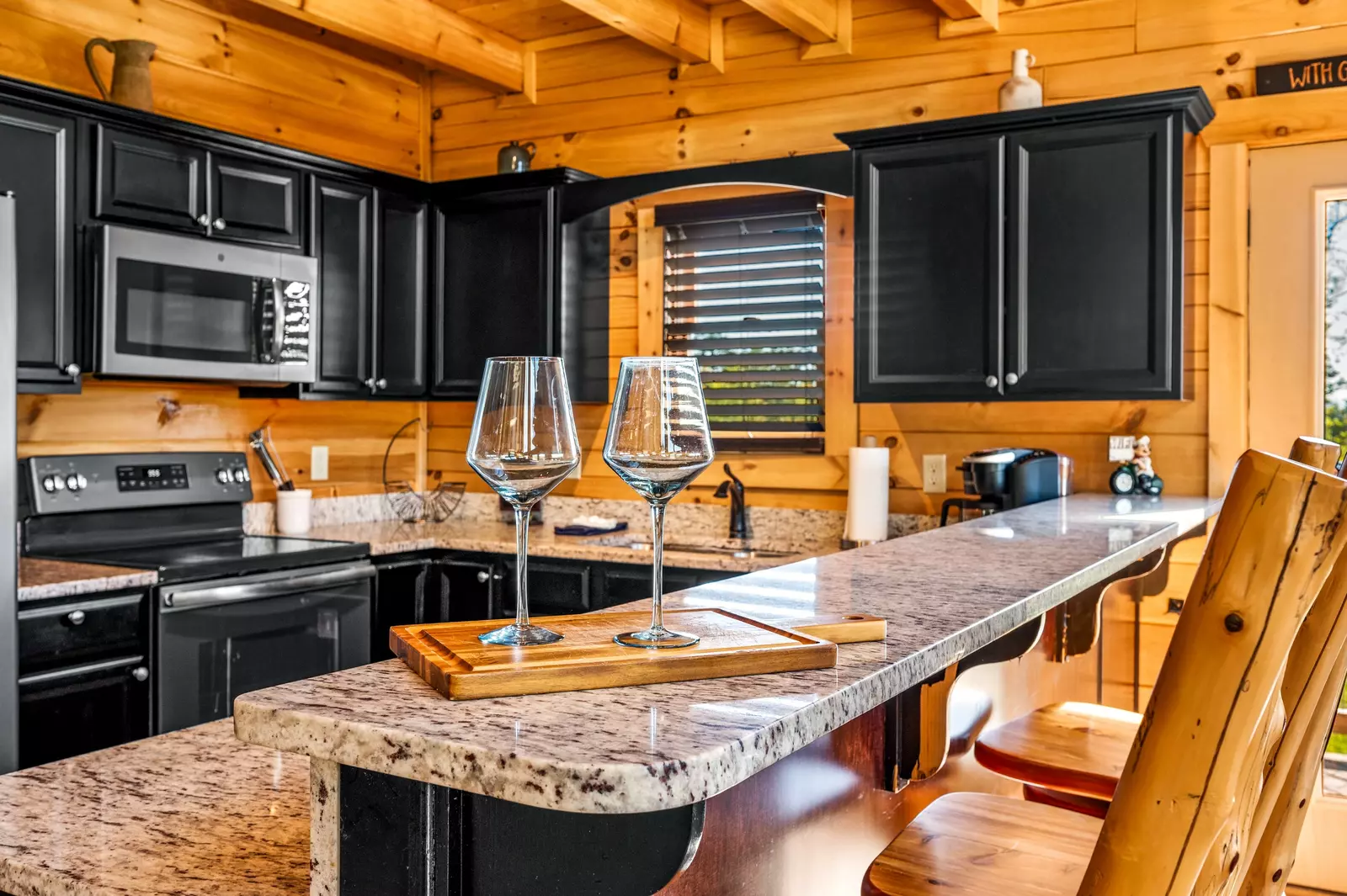 Nothin’ But a Good Time – a spacious 4-bedroom Smoky Mountain cabin rental in Sevierville featuring king bedrooms, twin bunks, hot tub, theater room, fire pit, and cozy mountain views.