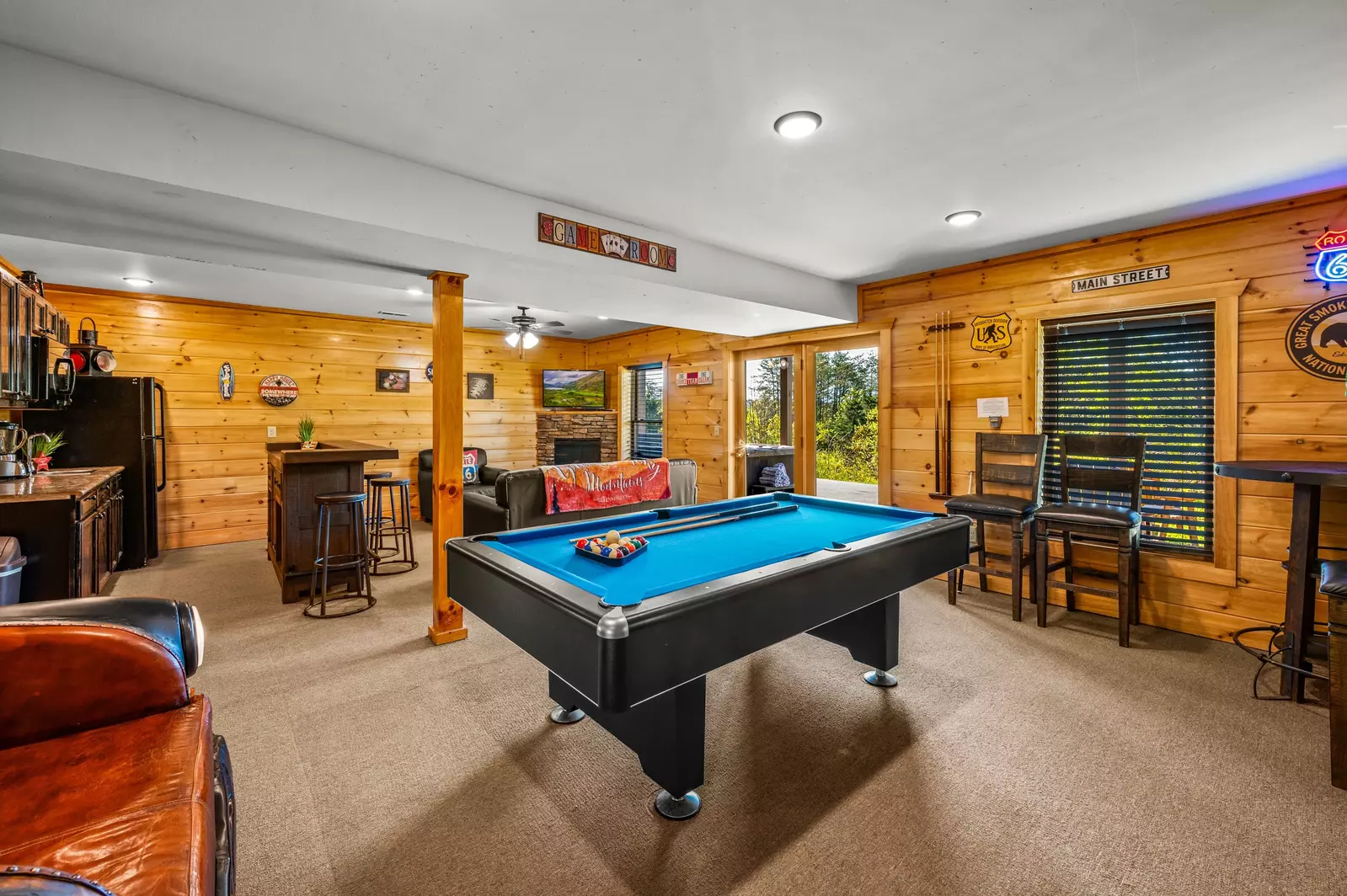 Nothin’ But a Good Time – a spacious 4-bedroom Smoky Mountain cabin rental in Sevierville featuring king bedrooms, twin bunks, hot tub, theater room, fire pit, and cozy mountain views.