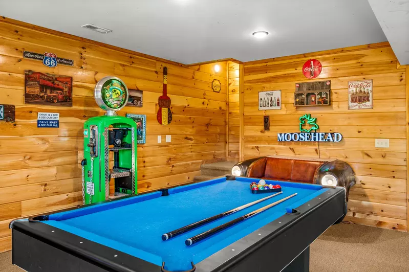 Nothin’ But a Good Time – a spacious 4-bedroom Smoky Mountain cabin rental in Sevierville featuring king bedrooms, twin bunks, hot tub, theater room, fire pit, and cozy mountain views.