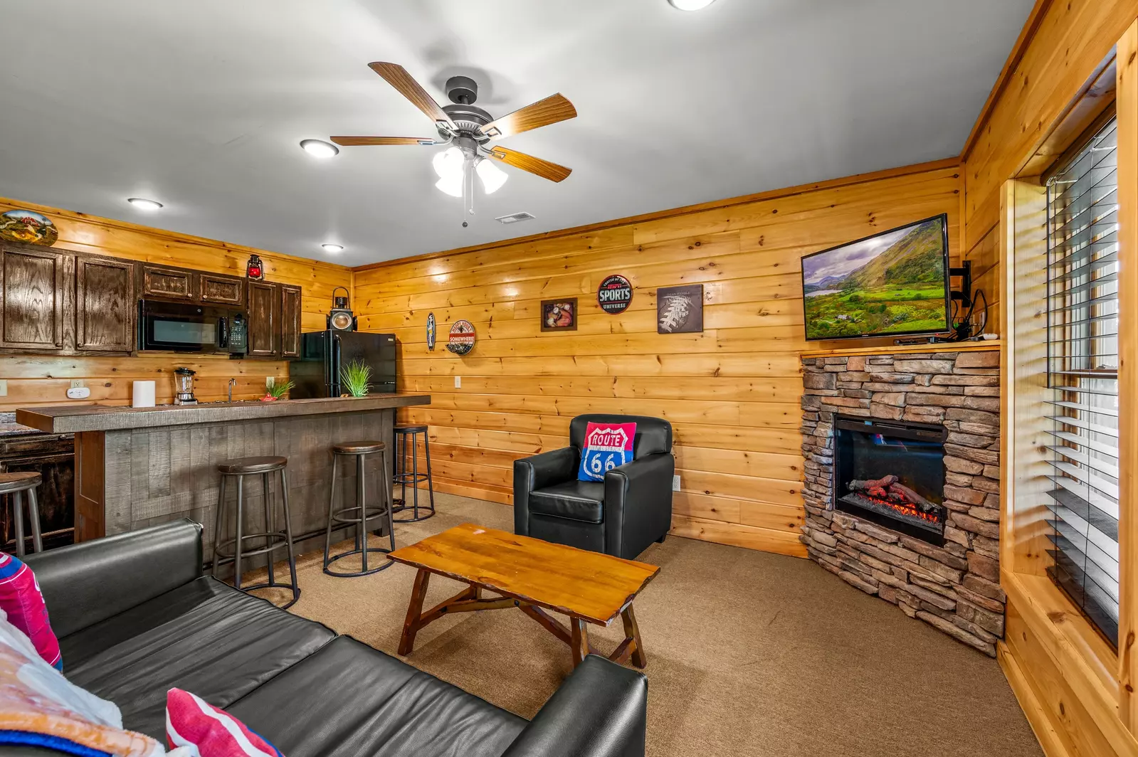 Nothin’ But a Good Time – a spacious 4-bedroom Smoky Mountain cabin rental in Sevierville featuring king bedrooms, twin bunks, hot tub, theater room, fire pit, and cozy mountain views.