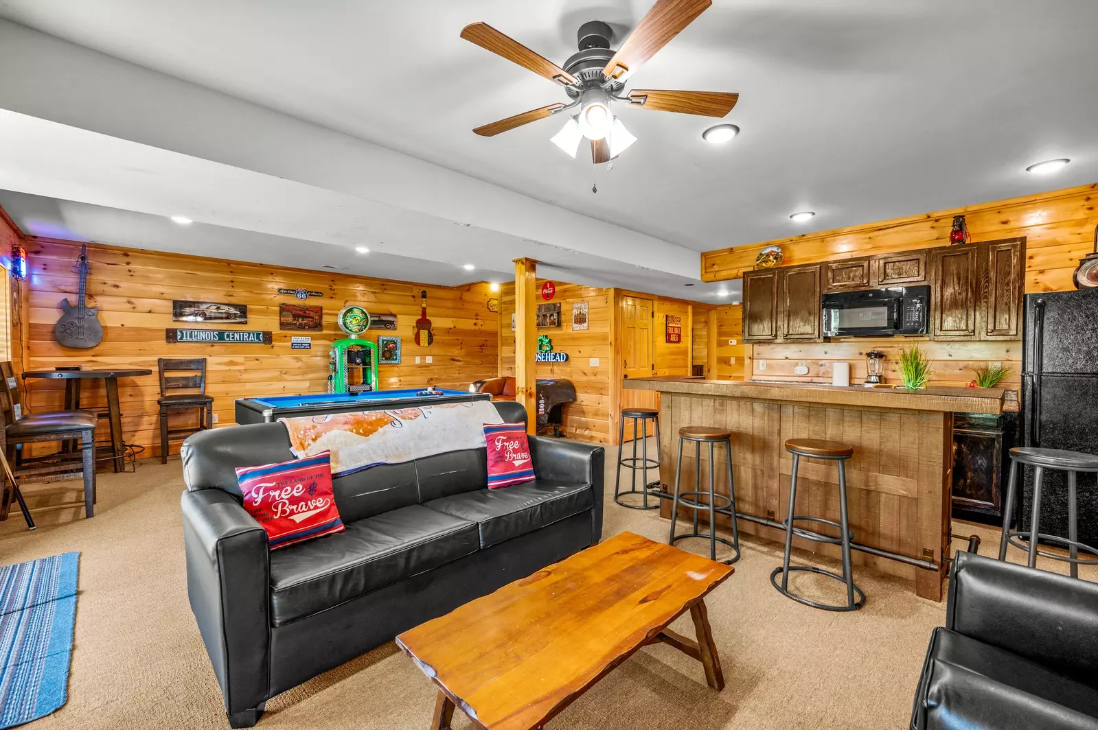 Nothin’ But a Good Time – a spacious 4-bedroom Smoky Mountain cabin rental in Sevierville featuring king bedrooms, twin bunks, hot tub, theater room, fire pit, and cozy mountain views.
