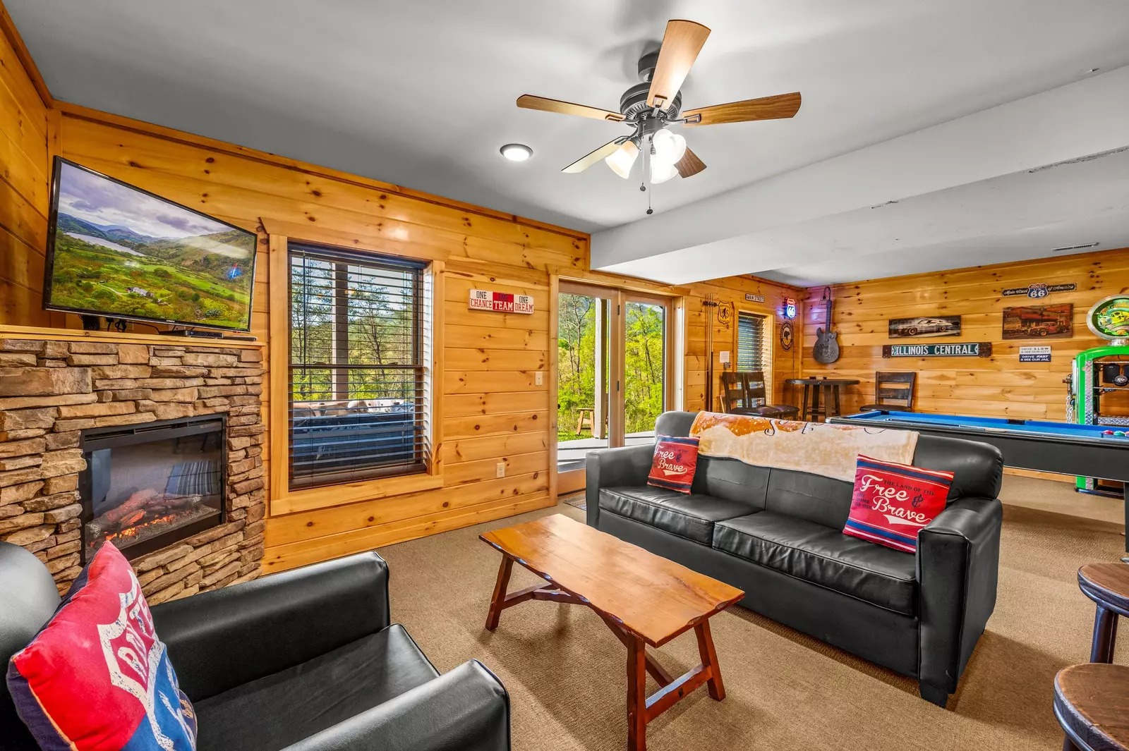 Nothin’ But a Good Time – a spacious 4-bedroom Smoky Mountain cabin rental in Sevierville featuring king bedrooms, twin bunks, hot tub, theater room, fire pit, and cozy mountain views.