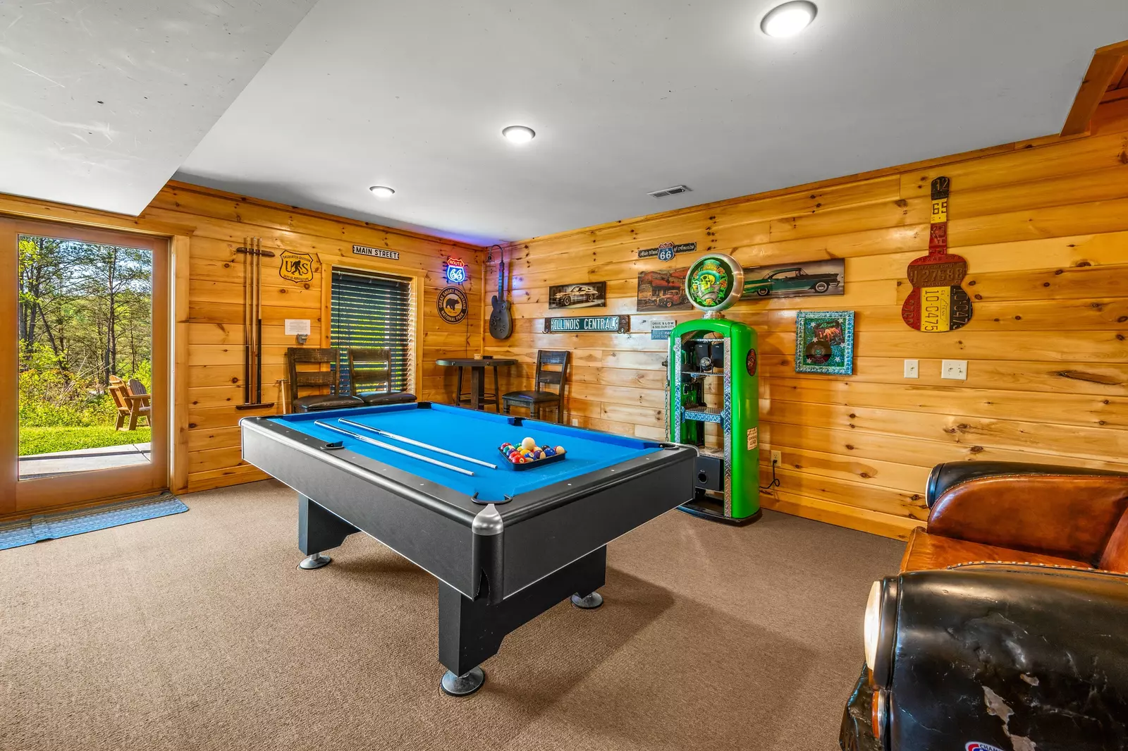 Nothin’ But a Good Time – a spacious 4-bedroom Smoky Mountain cabin rental in Sevierville featuring king bedrooms, twin bunks, hot tub, theater room, fire pit, and cozy mountain views.