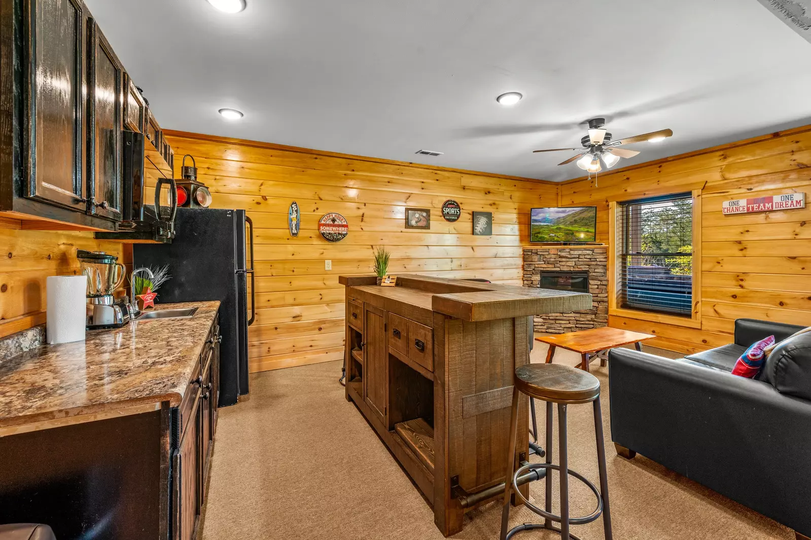Nothin’ But a Good Time – a spacious 4-bedroom Smoky Mountain cabin rental in Sevierville featuring king bedrooms, twin bunks, hot tub, theater room, fire pit, and cozy mountain views.