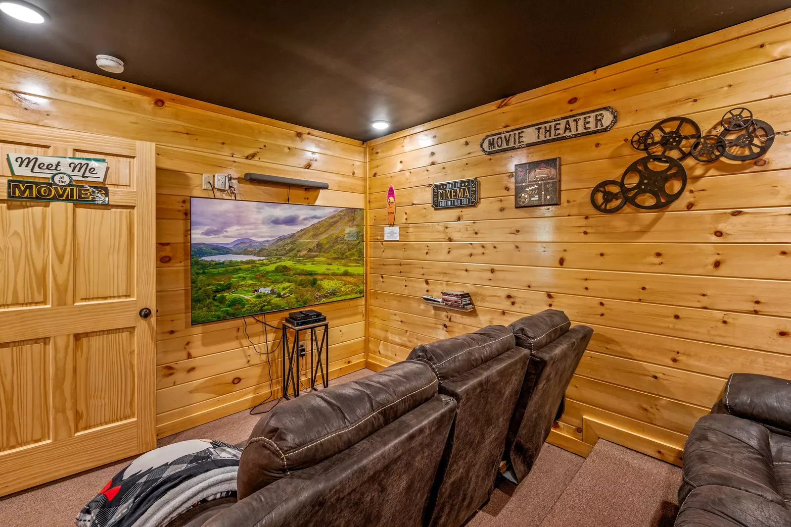 Nothin’ But a Good Time – a spacious 4-bedroom Smoky Mountain cabin rental in Sevierville featuring king bedrooms, twin bunks, hot tub, theater room, fire pit, and cozy mountain views.