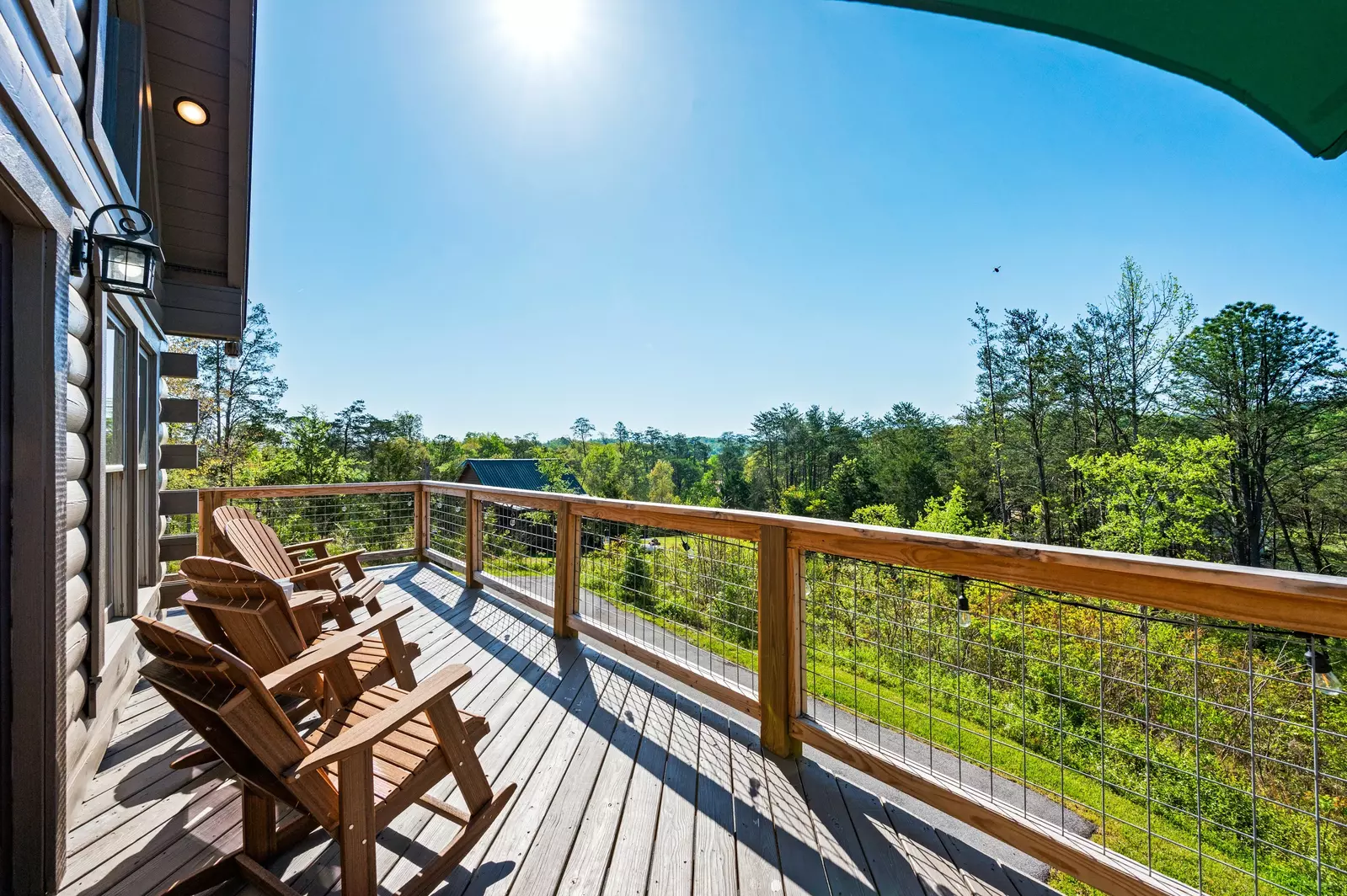 Nothin’ But a Good Time – a spacious 4-bedroom Smoky Mountain cabin rental in Sevierville featuring king bedrooms, twin bunks, hot tub, theater room, fire pit, and cozy mountain views.