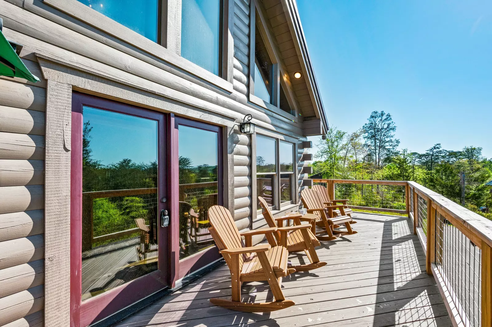 Nothin’ But a Good Time – a spacious 4-bedroom Smoky Mountain cabin rental in Sevierville featuring king bedrooms, twin bunks, hot tub, theater room, fire pit, and cozy mountain views.