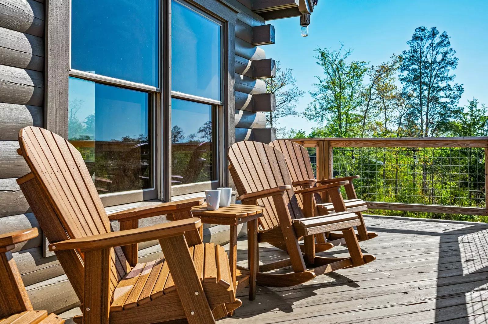 Nothin’ But a Good Time – a spacious 4-bedroom Smoky Mountain cabin rental in Sevierville featuring king bedrooms, twin bunks, hot tub, theater room, fire pit, and cozy mountain views.