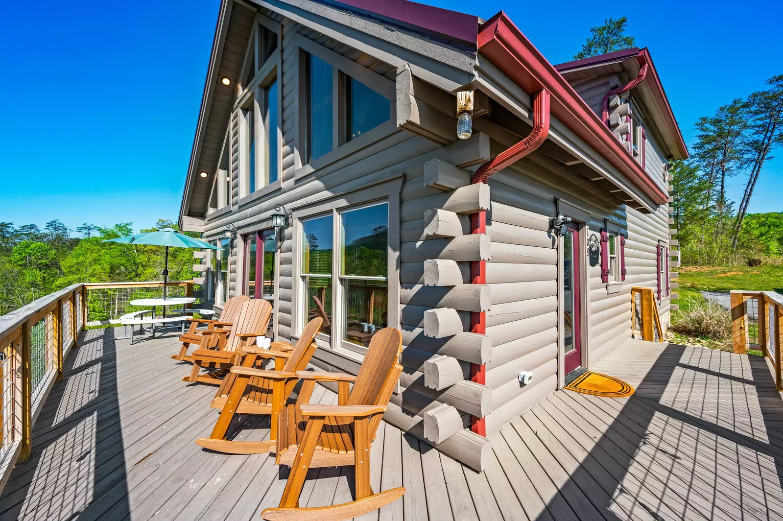 Nothin’ But a Good Time – a spacious 4-bedroom Smoky Mountain cabin rental in Sevierville featuring king bedrooms, twin bunks, hot tub, theater room, fire pit, and cozy mountain views.