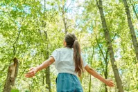 woman enjoying time in the woods