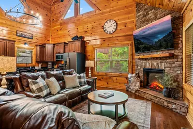 Open concept living room with large TV