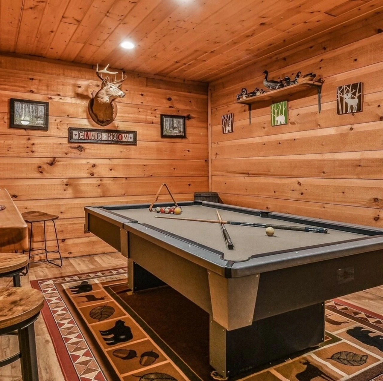 Game room with board games, dart board, mini frig and bar