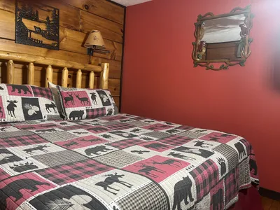 The red bedroom with a view of the ravine.