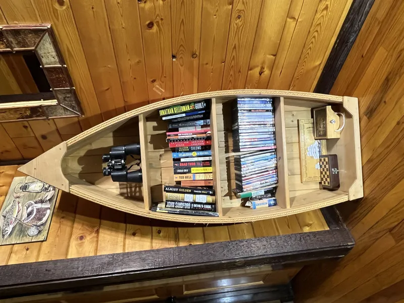 Canoe shelf for books, videos, games and such.