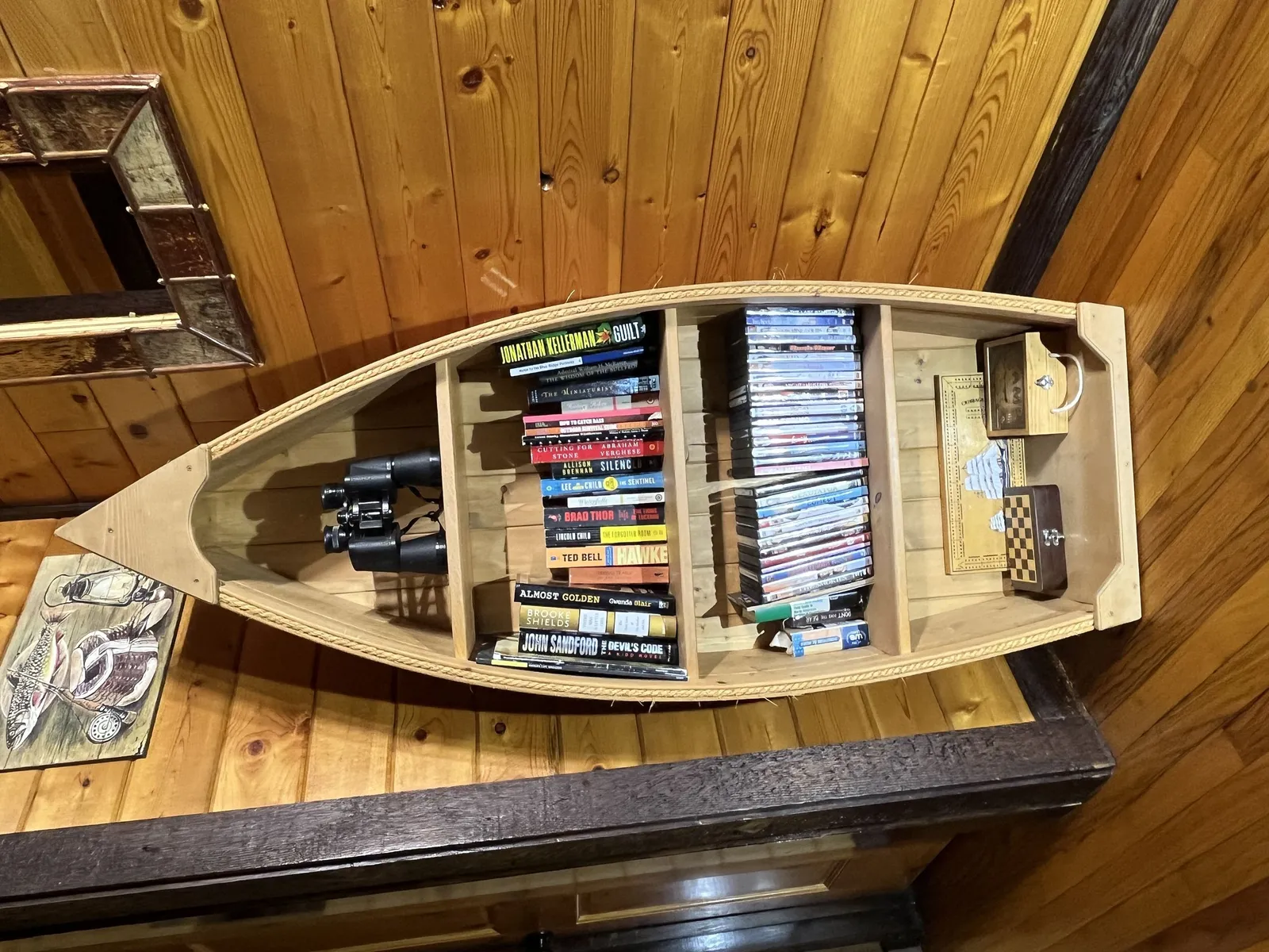 Canoe shelf for books, videos, games and such.
