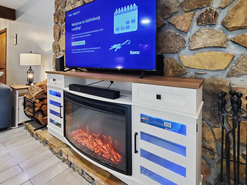 55 inch Roku smart TV, electric fireplace, variety of board and card games