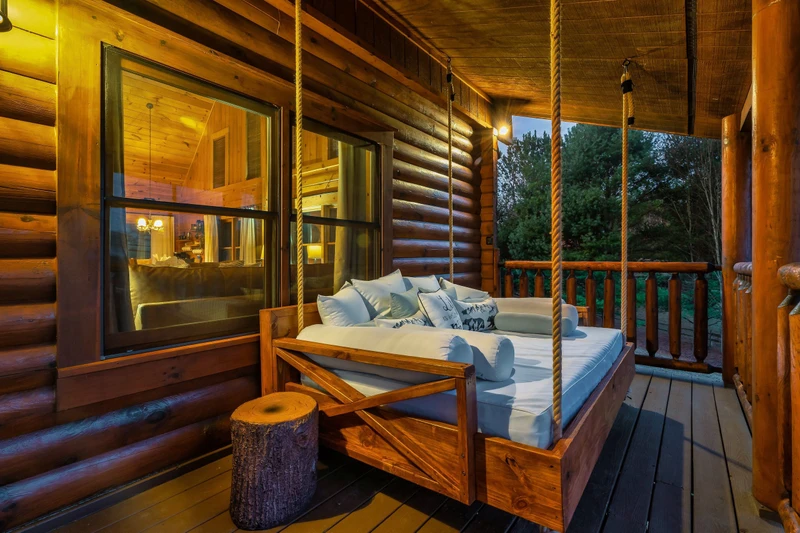 Relax on your private porch swing bed with panoramic Smoky Mountain views.