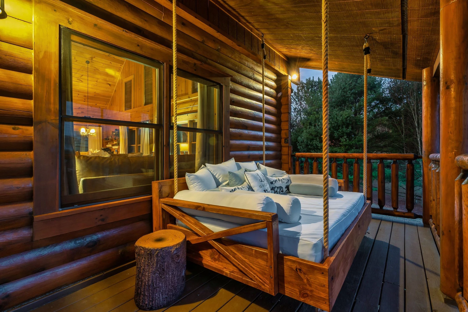 Relax on your private porch swing bed with panoramic Smoky Mountain views.