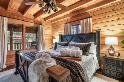 Main level king bedroom designed for rest and comfort.