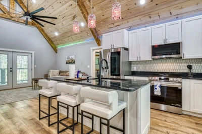 Mountain Lake Home bar top and fully furnished kitchen with granite countertops