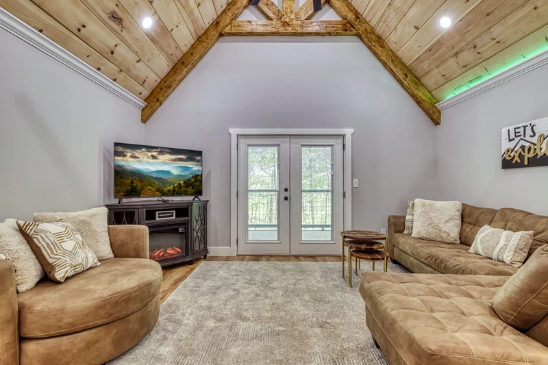 Mountain Lake Home living room with deck access
