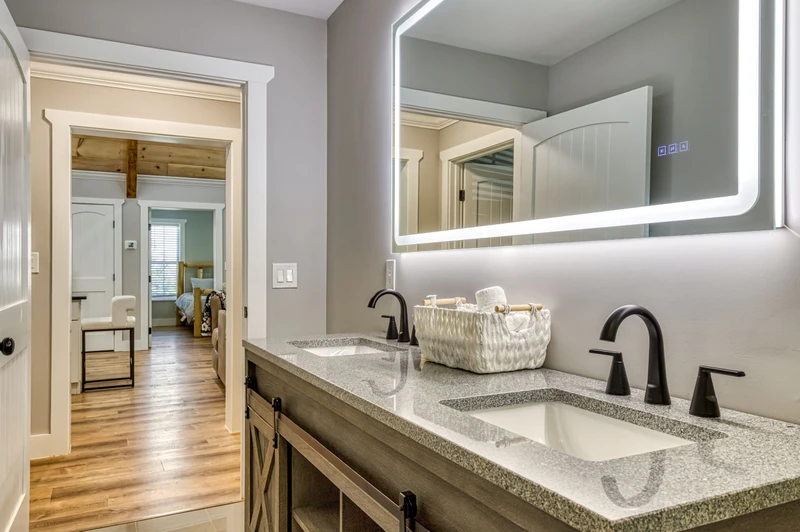 Mountain Lake Home bathroom with double vanity and heated mirrors