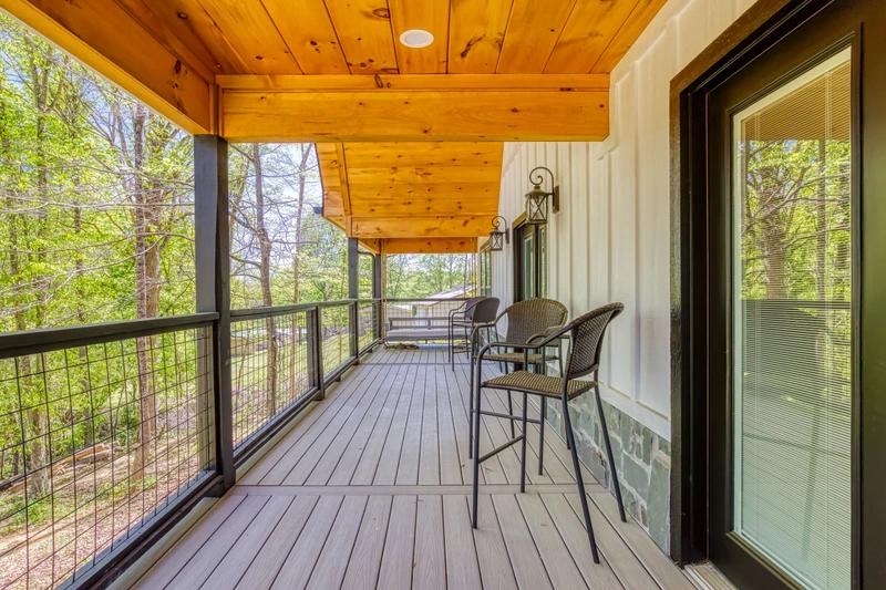 Mountain Lake Home covered back deck with seating area