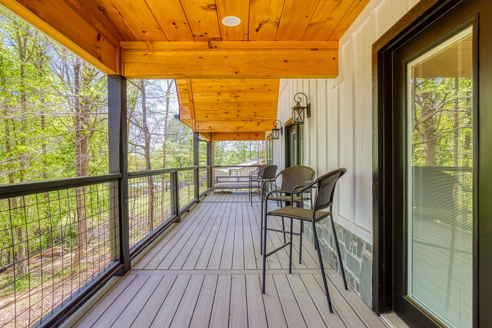 Mountain Lake Home covered back deck with seating area