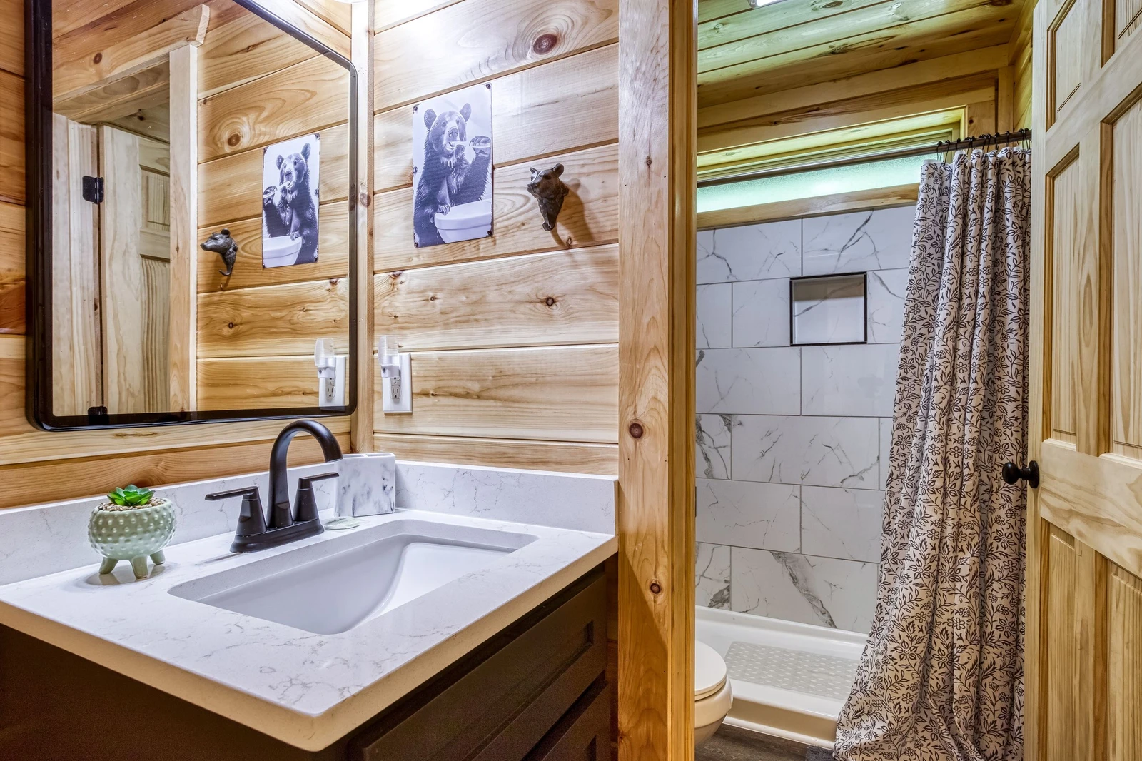 Mountain Memories main level bathroom with single vanity and walk in shower