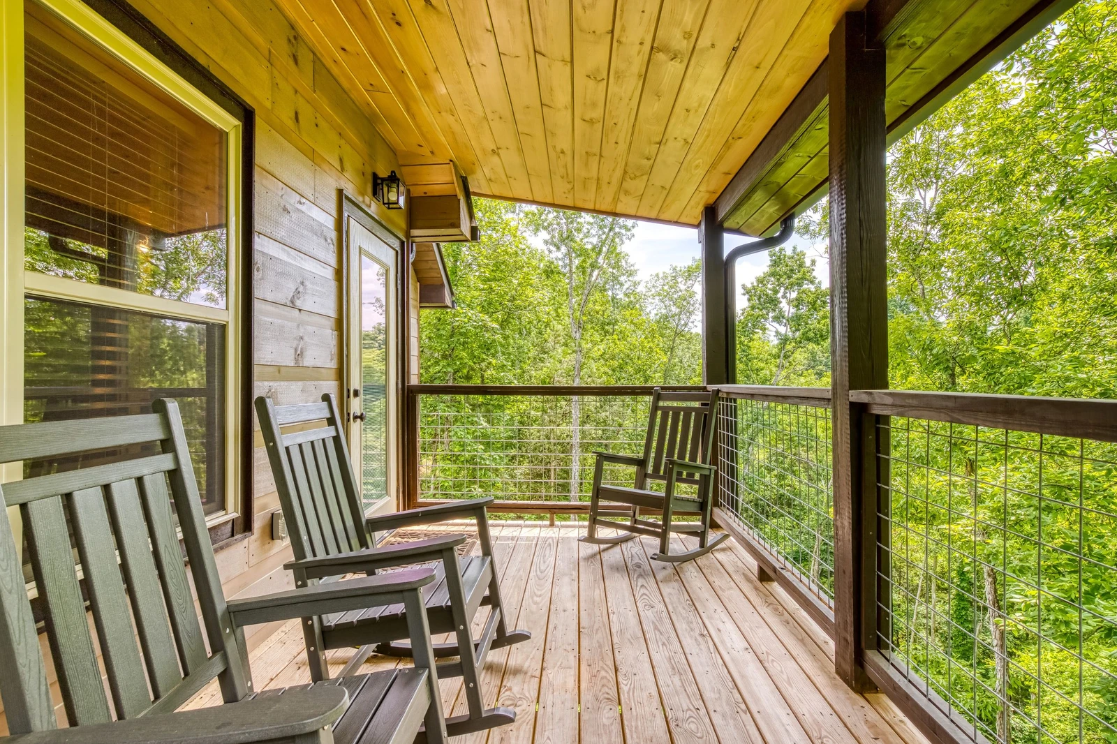 Mountain Memories rocking chairs on main level covered back deck