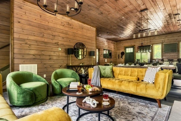 Stylish living room with plush seating & electric fireplace, perfect for family time