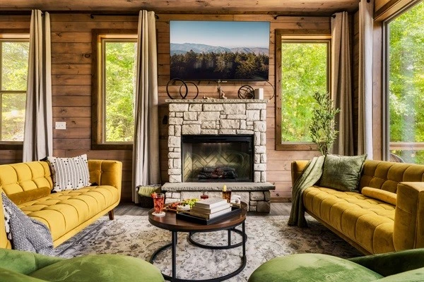 Stylish living room with plush seating & electric fireplace, perfect for family time
