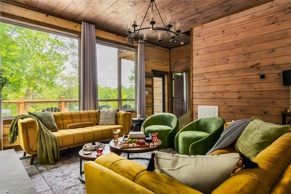 Stylish living room with plush seating & electric fireplace, perfect for family time