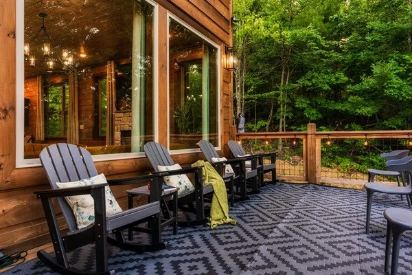Spacious deck with string lights, and nature views