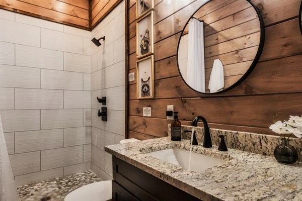 Bathroom 6 (bunk room) en suite full bathroom with double vanity and walk-in shower