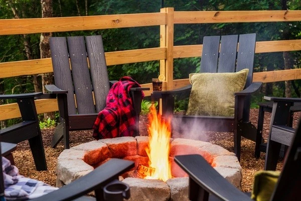 Backyard with fire pit and string lights