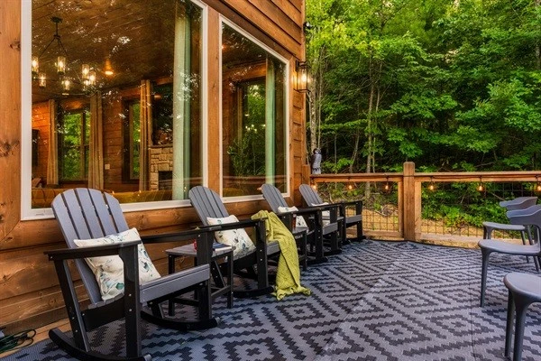 Enjoy your coffee on the rockers on the back decks with string lights