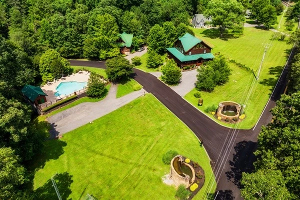 Beautiful aerial view of the smoky Cove resort community showing the outdoor community pool and entrance to the resort