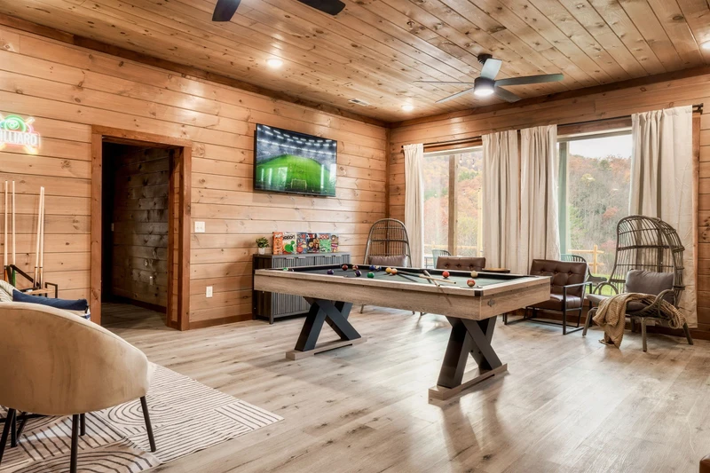Game Room with pool table, arcades, other games and TV, Theater in background
