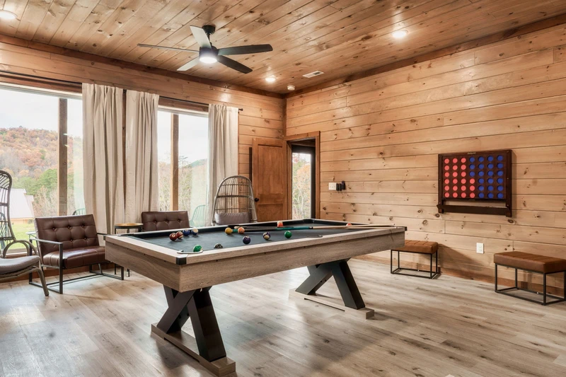 Game Room with pool table, arcades, other games and TV, Theater in background
