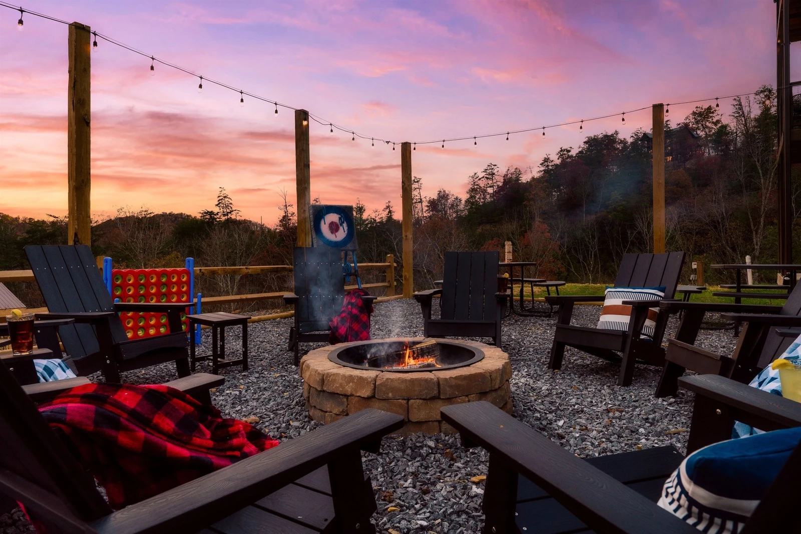 Fire Pit in backyard with picnic tables & views