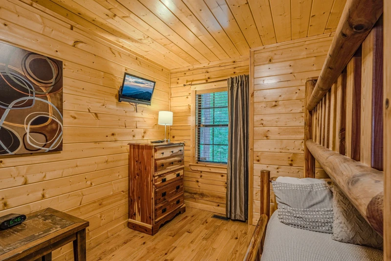 h bedroom on lower level with bunk beds and TV