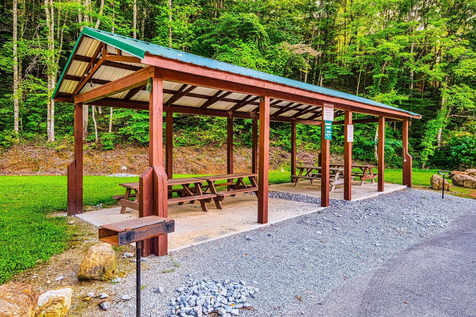 Picnic tables and BBQ by the resort pool